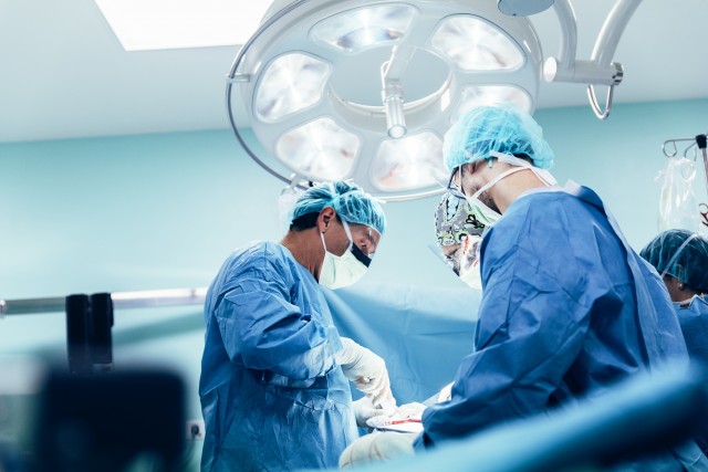 Surgeons preforming an operation which was standard of care for head and neck cancer patients prior to the PET-NECK trial.